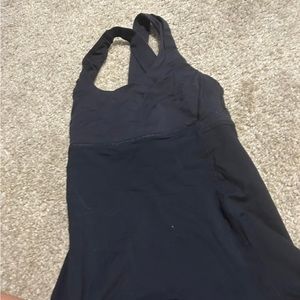 Lulu top either a size 2 or 4. Pretty sure a 4. Built in bra (no padding)